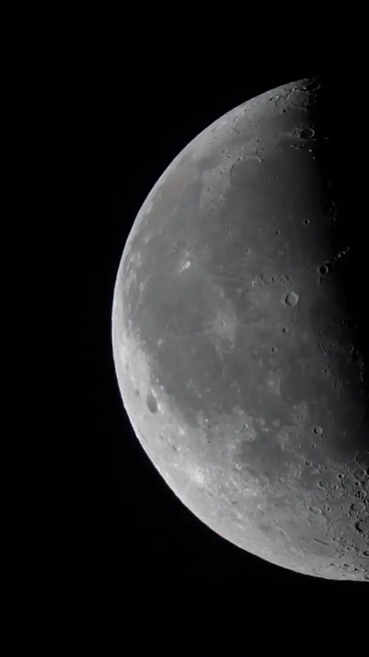Vertical brand film with hard cuts from lunar surface to robotics, infrastructure, engineering, and the Optimus Lunar mark